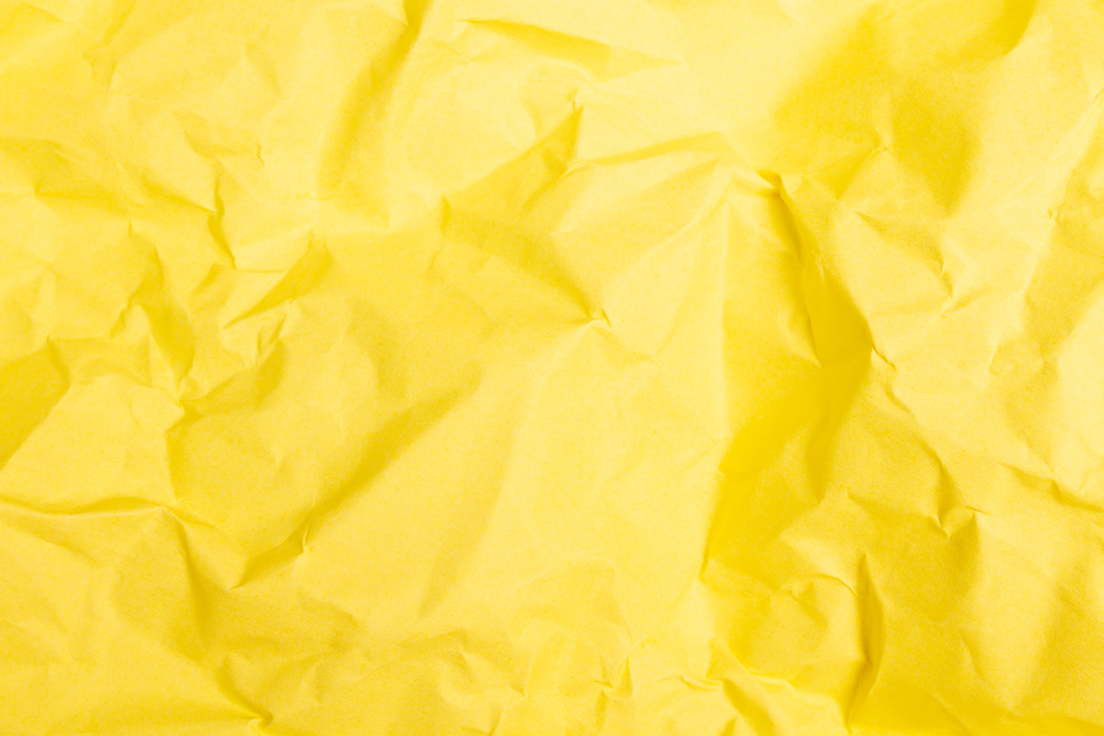 A Close-Up Shot of a Crumpled Yellow Paper